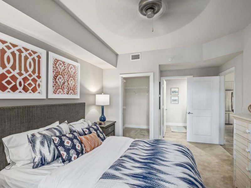 This image shows the premium feature in the bedroom area with the modern touch of fabrics and offers a ceiling fan for a pleasant ambiance. This area was also accessible to the closet, living room area, and to the bathroom that will surely make the resident comfier.