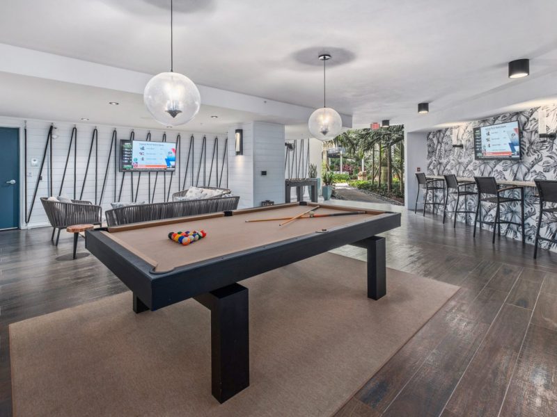 This image shows the expansive view inside the indoor billiard and TV lounge in TGM Harbor Beach Apartment featuring an ideal space for fun moments with friends and family.